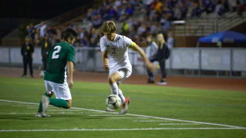 The Sumner captain takes on a Skyline defender at the 2018 Washington State Soccer Championship semifinal