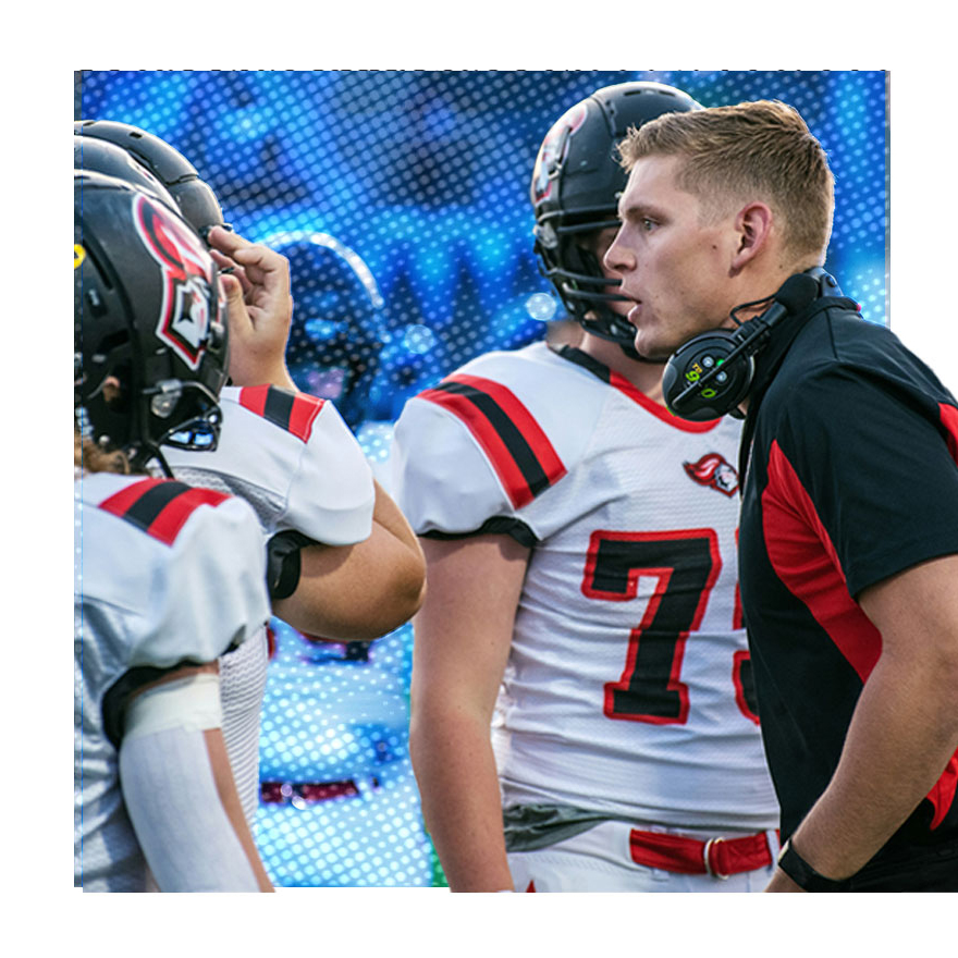 coach talking to footballlplayer