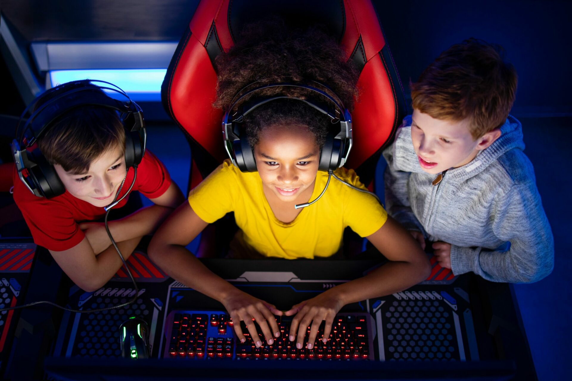 Three kids playing video games.